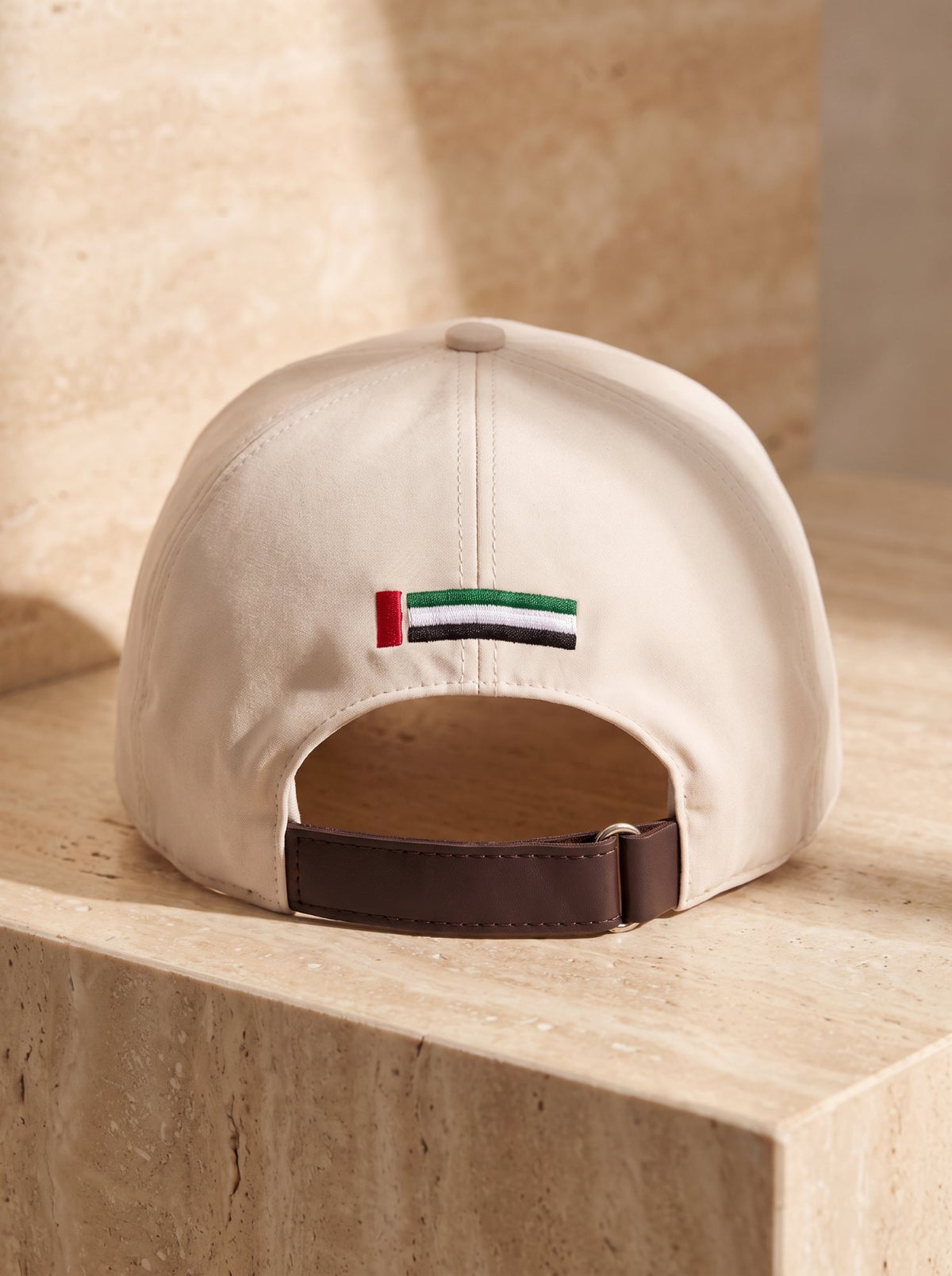 Rear of the cap with UAE flag embroidery and leather strap